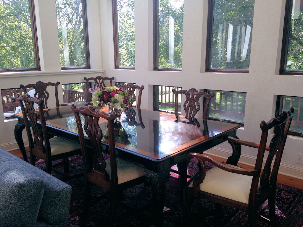 Dining room in the great room with tall windows