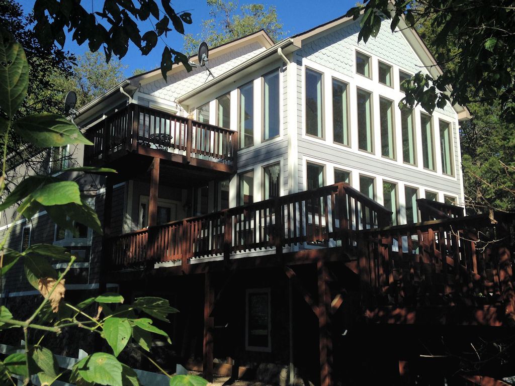 Balcony and deck of the house among the trees